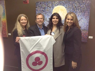 Rebecca Tobias, Phillip Hellmich, Sande Hart  with the Roerich Banner of Peace